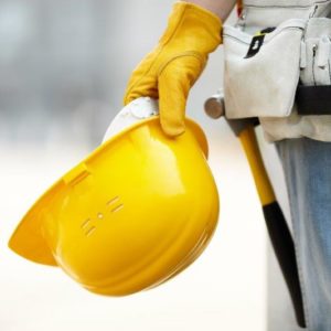 Worker holding hard hat